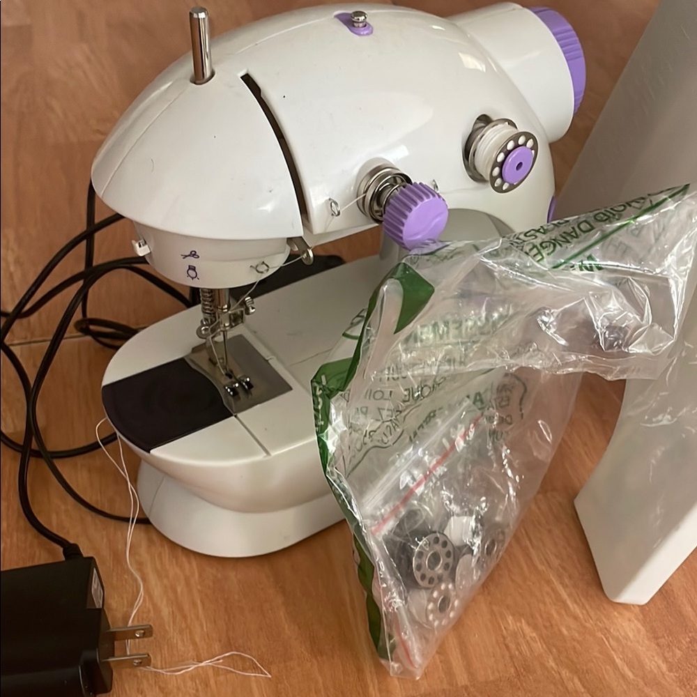 Compact White and Purple Sewing Machine